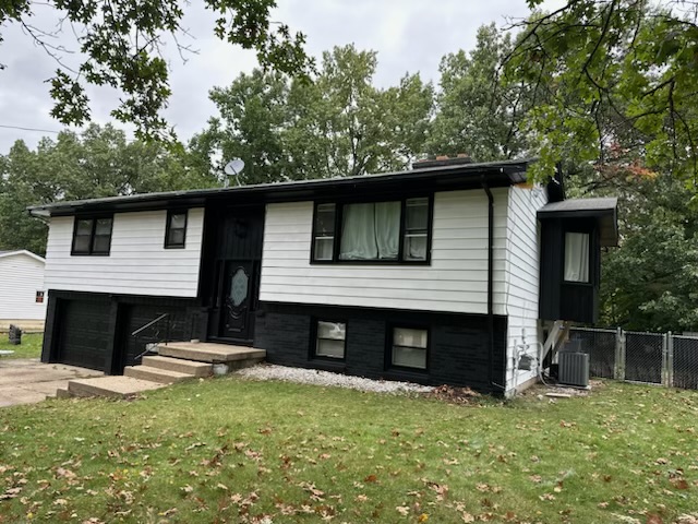 Professional exterior house painting project in Grand Rapids, MI, showcasing a beautifully updated home.