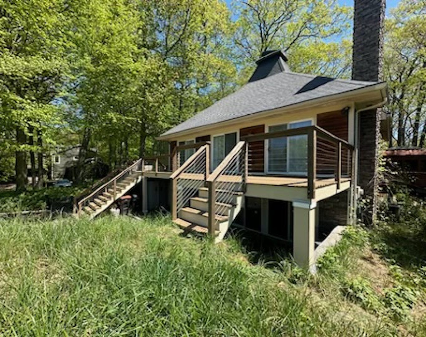 Professional exterior house painting project in Grand Rapids, MI, showcasing a beautifully updated home.